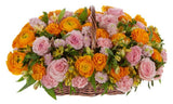 Basket of Orange Ranunculus in Pink